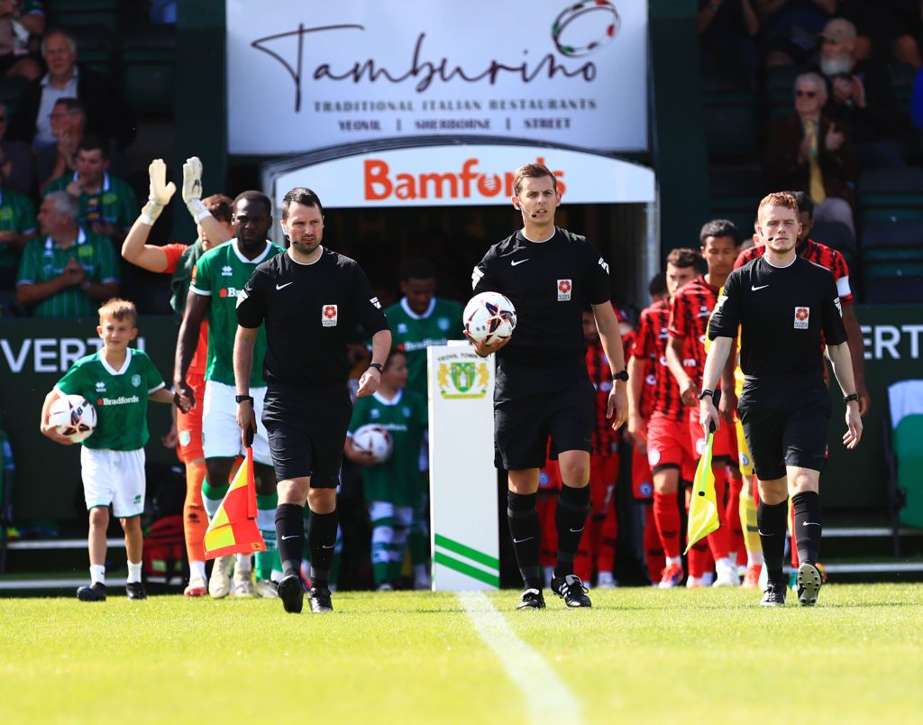 Yeovil vs Rochdale. The players enter the field of play.
