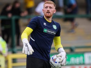 Yeovil Town goalkeeper Aidan Stone warming up ahead of the pre-season friendly with Bristol Rovers.