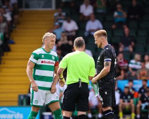 Jake Wannell involved in a coin toss.