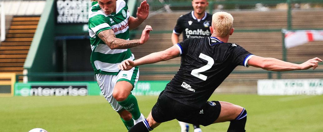 Trialist Luke McCormick runs past a Bristol Rovers player in a pre-season friendly match.