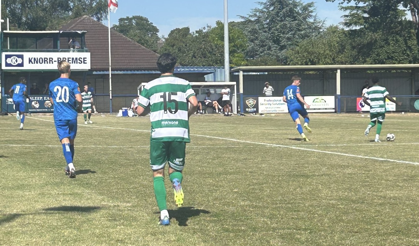 Yeovil Town trialists Teo Kurtaran, back to the camera wearing number 15, and striker Abu Kanu, no number, in action in the 3-2 win at Chippenham Town on Saturday.