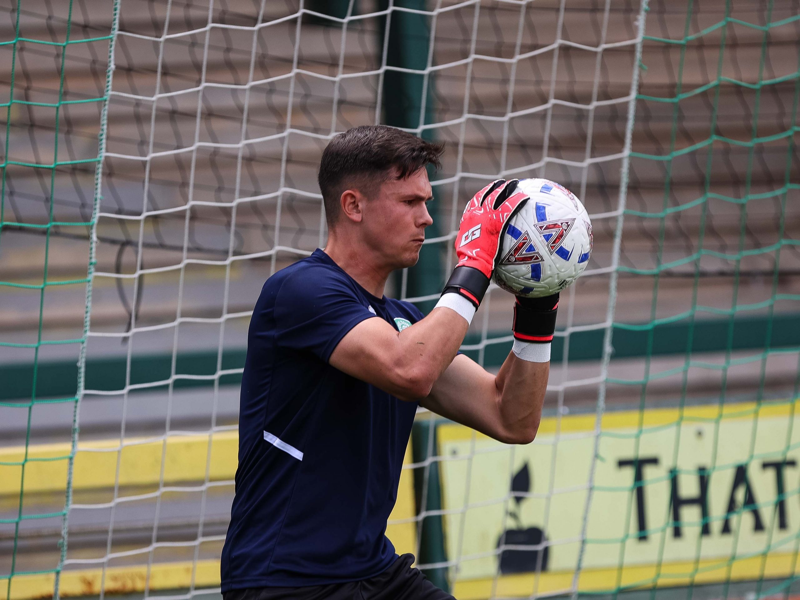 Jed Ward holds a shot during pre-match warm up.