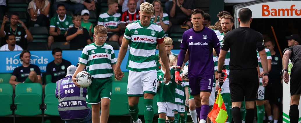 Jake Wannell leads Yeovil Town's players on to the pitch.