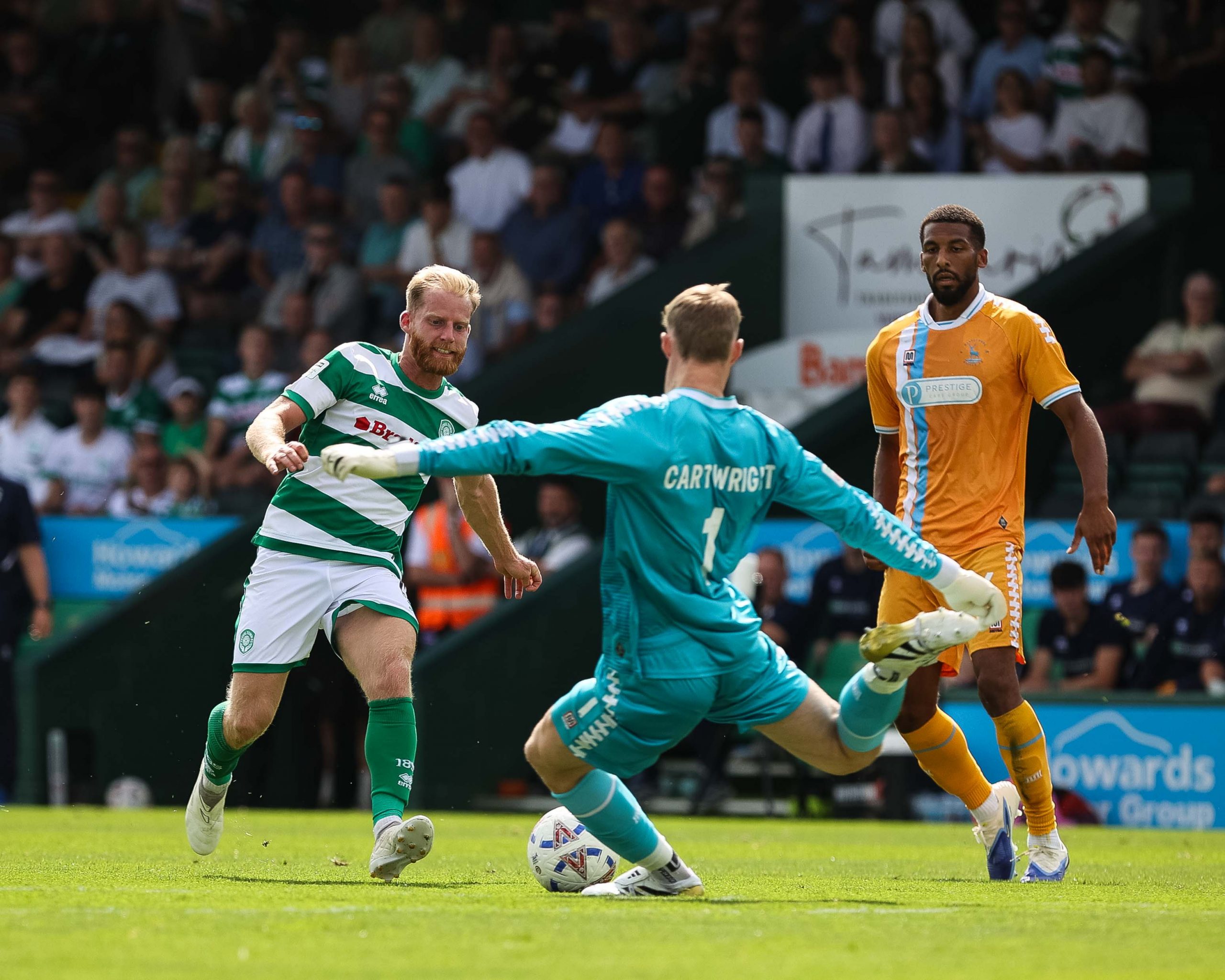 Josh Sims misses out on a 50-50 ball to Hartlepool keeper Harvey Cartwright.