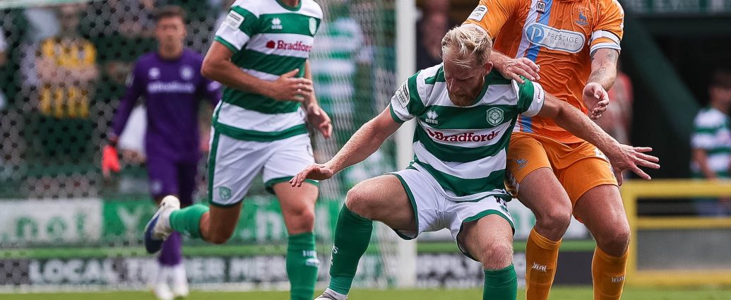 Josh Sims holds off a defender.
