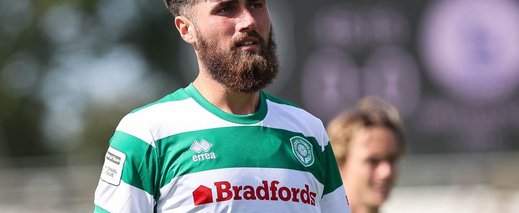 Aaron Jarvis looks on.