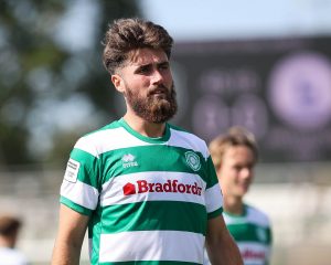 Aaron Jarvis looks on.