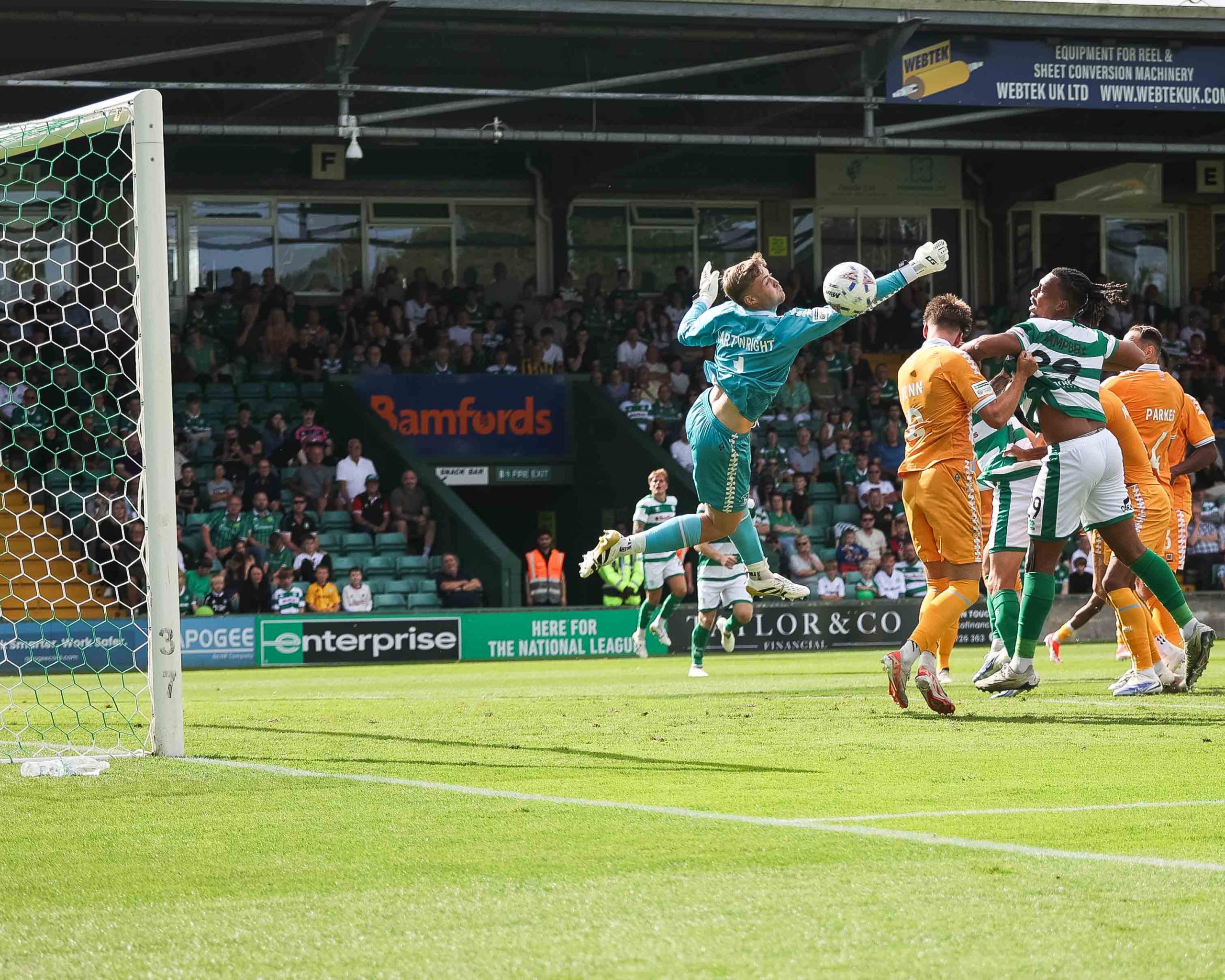 Yeovil Town striker Tahvon Campbell cannot quite connect with a cross as Hartlepool keeper Harvey Cartwright misses his punch.