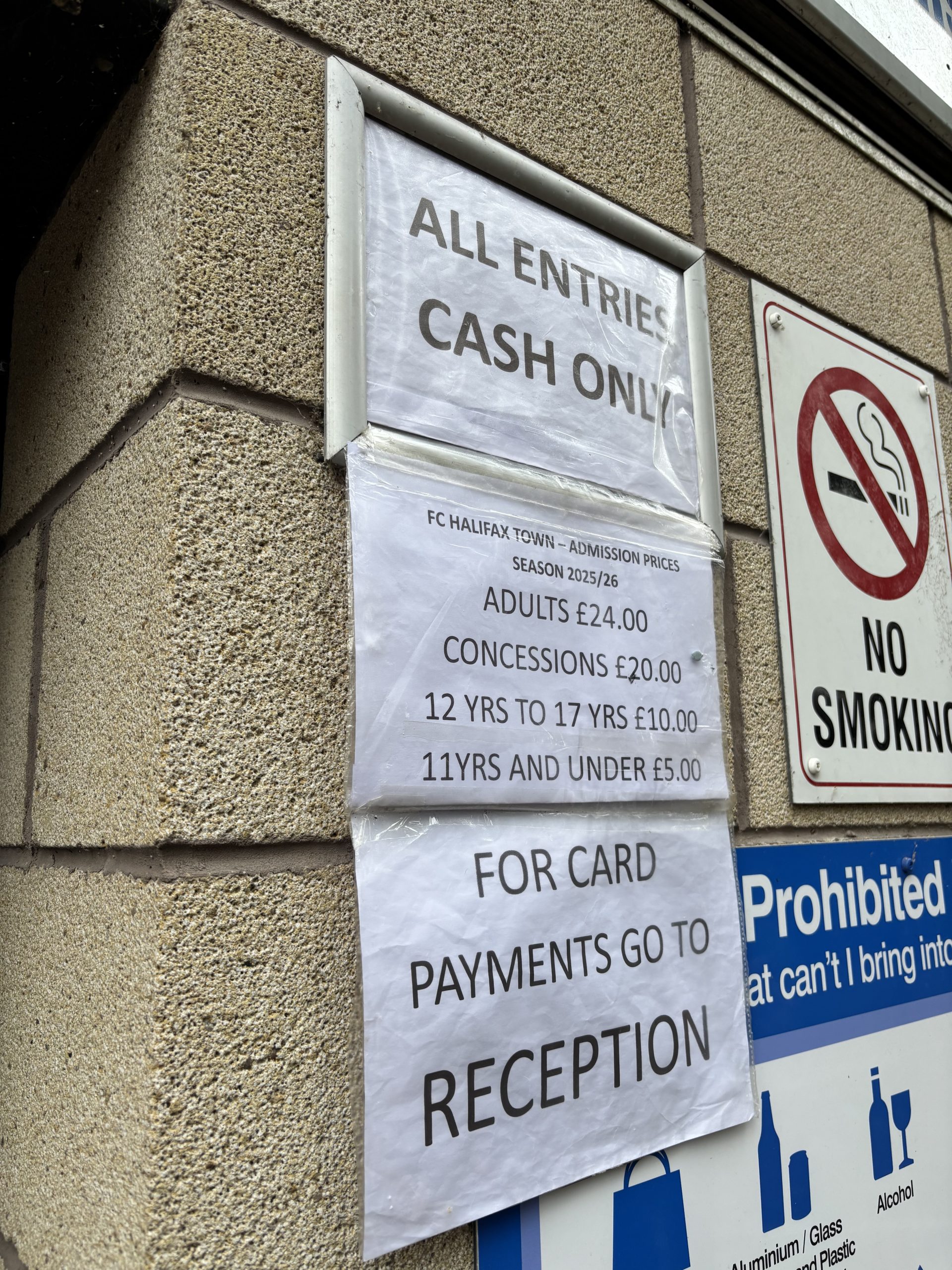 A sign showing All Entry Cash Only outside FC Halifax Town.