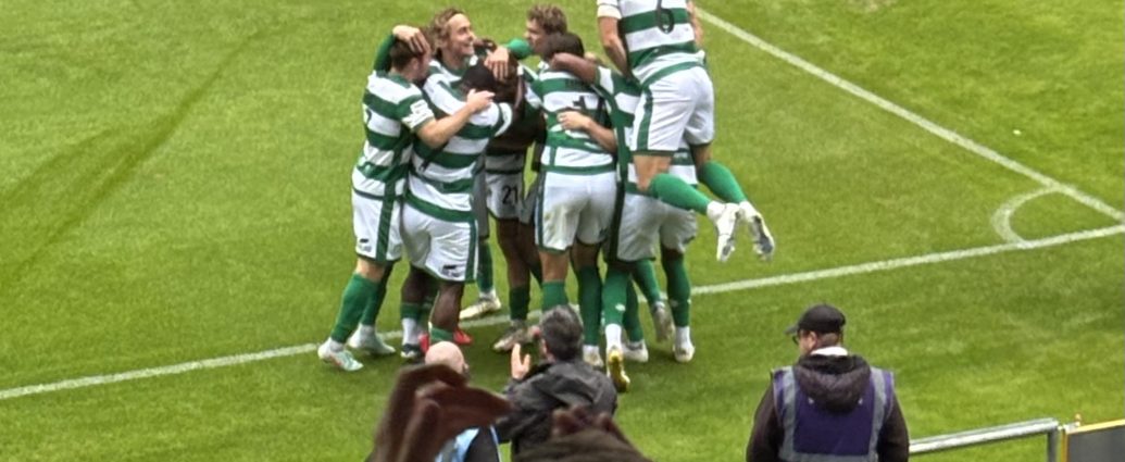 Yeovil Town's players jump on striker Harvey Greenslade after his 58th minute goal.
